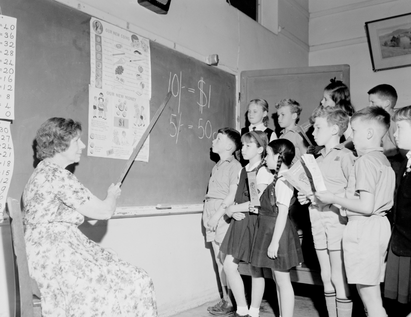 Children learning about decimal currency