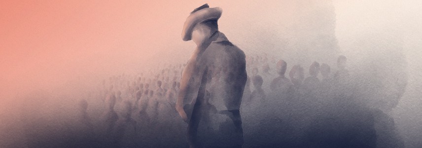 Dawn Service - soldier standing in a field of poppies