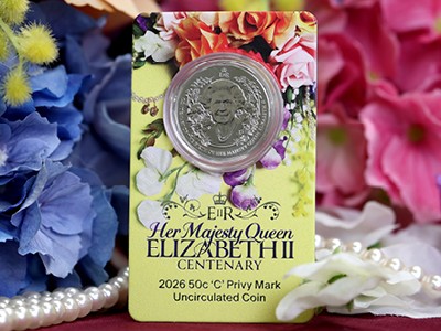 Queen Elizabeth II Privy Mark Coin in Card against a floral background.
