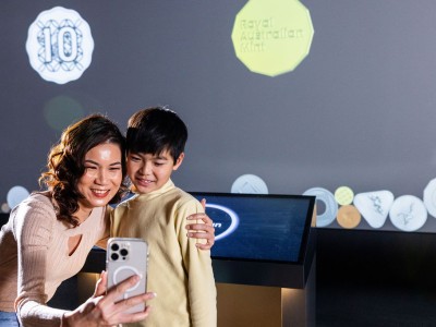 A mother and son take a selfie at the Mint.
