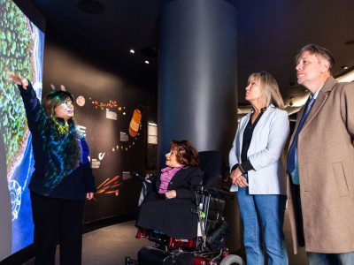 Guests take a tour inside the Mint.