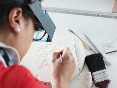 Coin designer drawing and designing a coin.