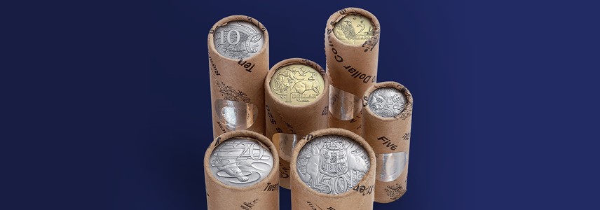 Premium coin rolls against a navy background.